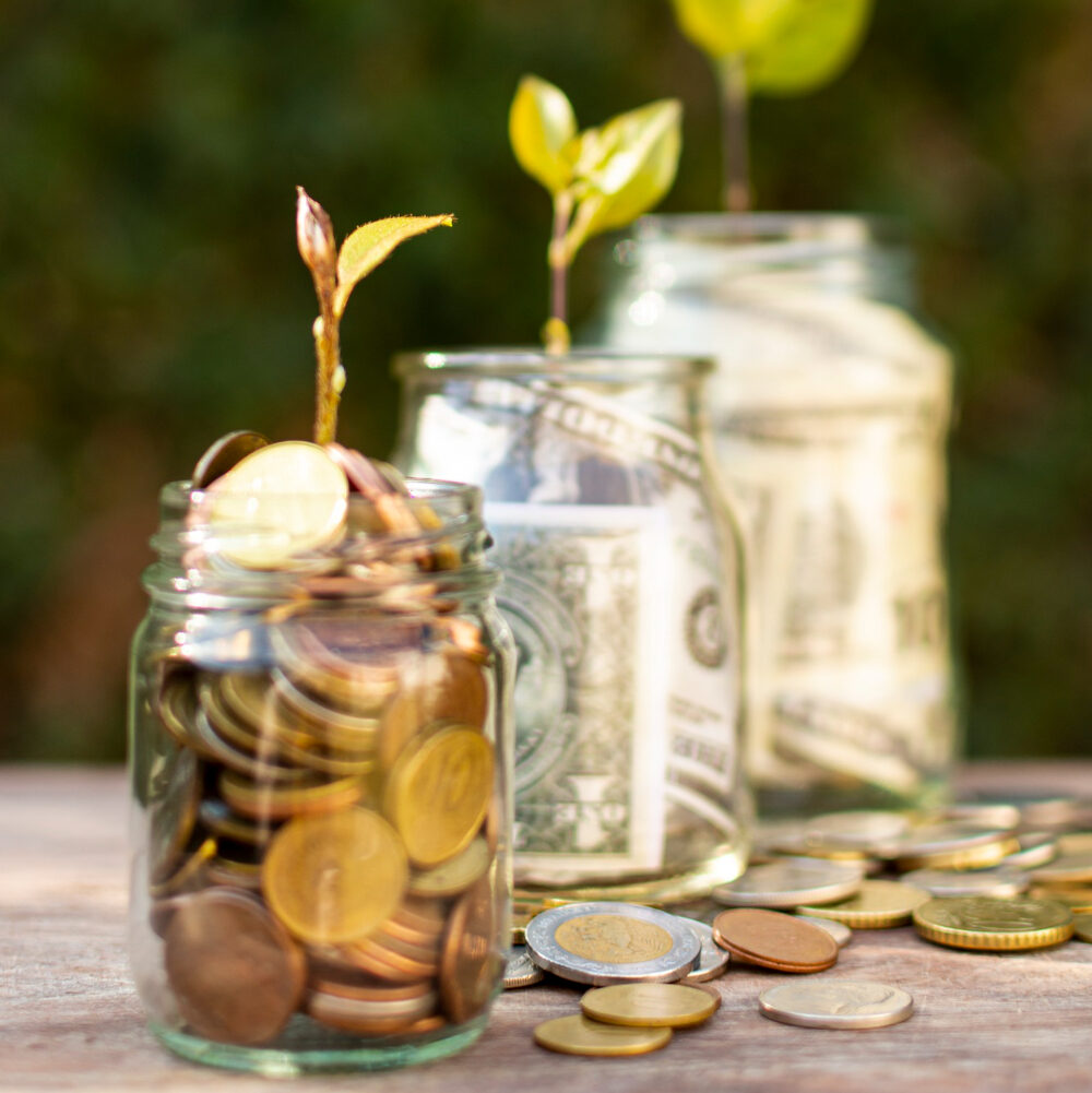 Jar Full Of Coins That Denotes Investment. Go Fund Yourself Podcast Episode Related To Investment Based Life Insurance In Canada