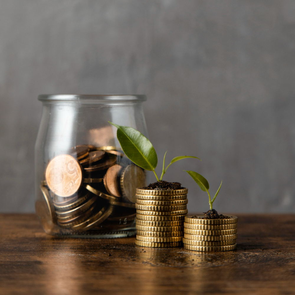 Coins Inside A Jar And The Money Grows From It