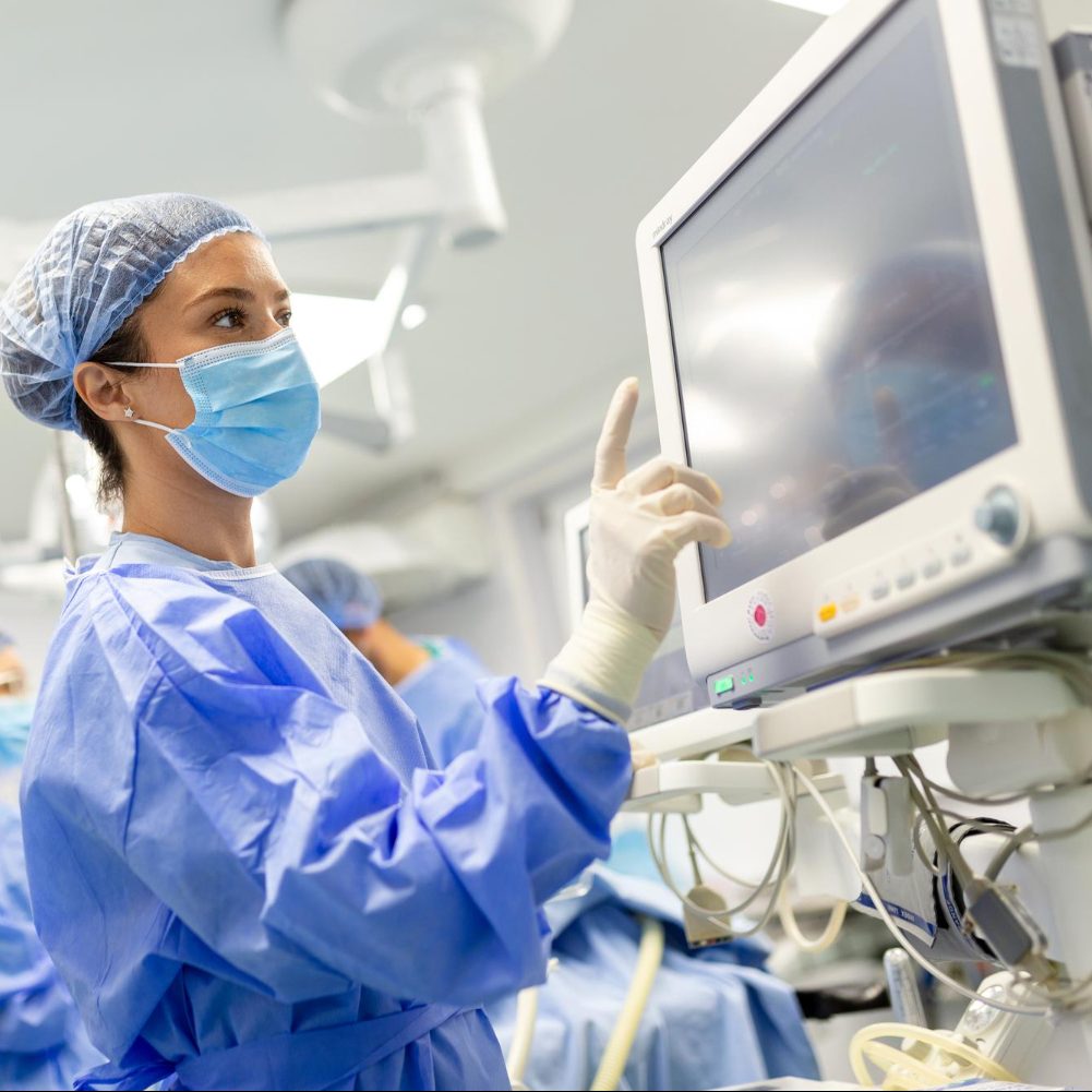 A Canadian Doctor In Icu Checking Monitor Of A Critical Illness Patient In A Hospital In Ontario.